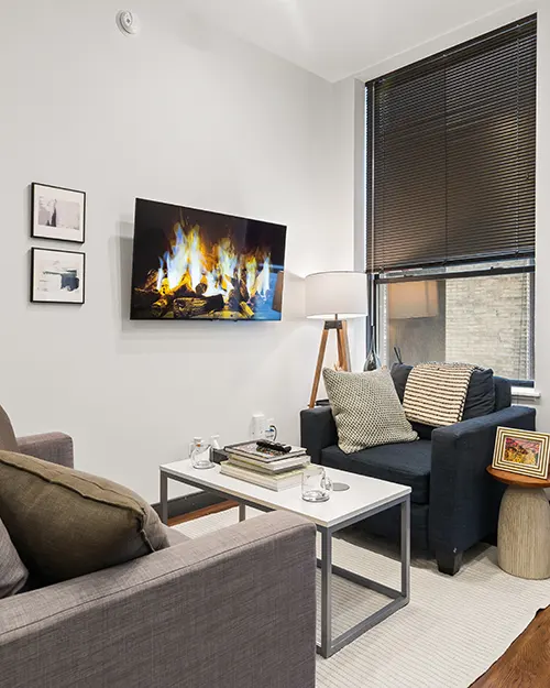 Contemporary apartment kitchen featuring stainless steel appliances and sleek cabinetry